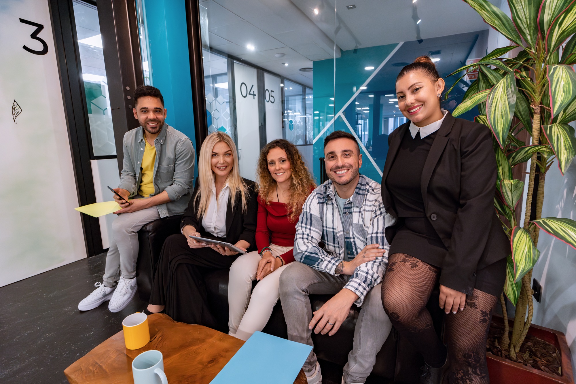 Business people smiling while posing together in the office.